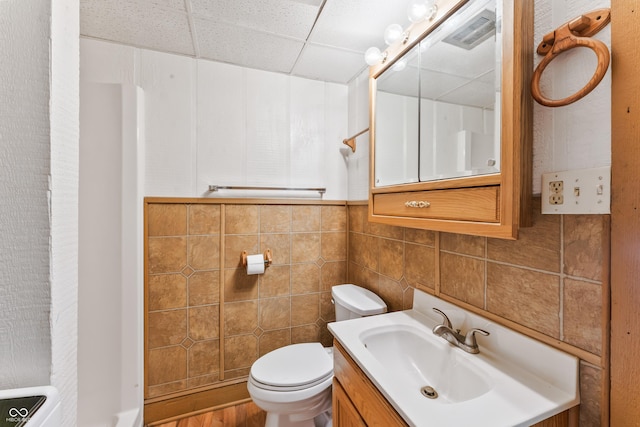 19120 Tomlinson Rd, Westfield, IN 46074 - bathroom featuring vanity, tile walls, a drop ceiling, and wood finished floors