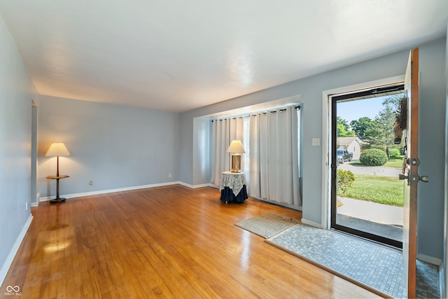 2635 15th St, Columbus, IN 47201 - empty room featuring wood finished floors and baseboards