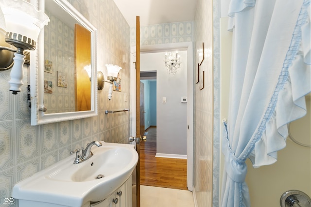 2635 15th St, Columbus, IN 47201 - full bathroom featuring vanity and wood finished floors