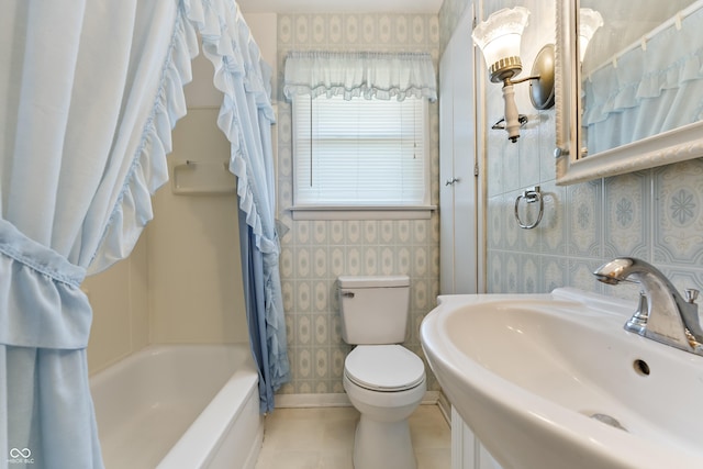 2635 15th St, Columbus, IN 47201 - full bathroom with shower / bath combo, tile walls, and tile patterned flooring