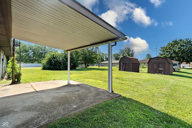 2635 15th St, Columbus, IN 47201 - view of grassy yard with a storage unit and a patio area