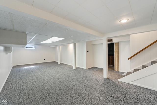 2635 15th St, Columbus, IN 47201 - basement featuring stairs, a drop ceiling, and carpet