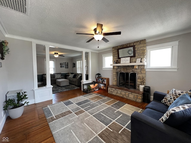 215 N Main St, Batesville, IN 47006 - living area featuring ceiling fan, ornamental molding, wood finished floors, a textured ceiling, and plenty of natural light