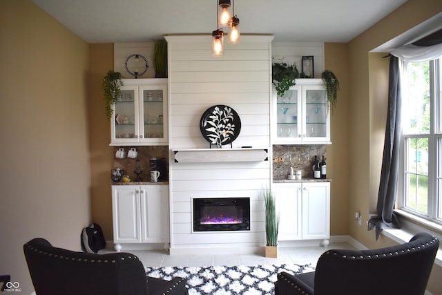 5817 Mustang Ter, Plainfield, IN 46168 - living room featuring healthy amount of natural light, light tile patterned floors, and a large fireplace