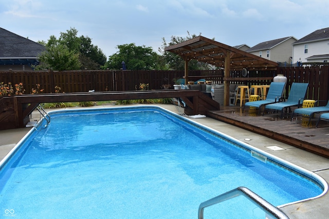 5817 Mustang Ter, Plainfield, IN 46168 - view of swimming pool featuring a fenced backyard, a wooden deck, and a pergola