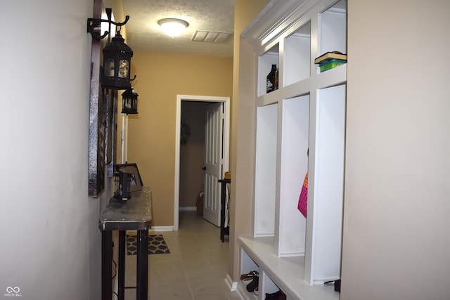5817 Mustang Ter, Plainfield, IN 46168 - mudroom with a textured ceiling and tile patterned floors