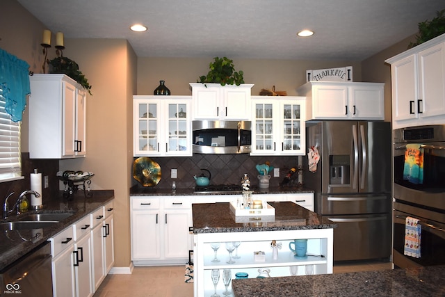 5817 Mustang Ter, Plainfield, IN 46168 - kitchen featuring stainless steel appliances, white cabinets, backsplash, dark stone countertops, and recessed lighting