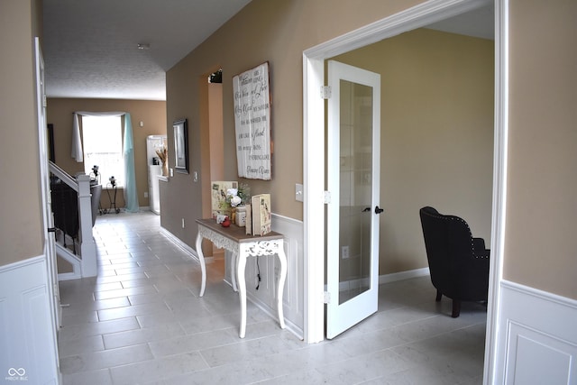 5817 Mustang Ter, Plainfield, IN 46168 - hallway featuring light tile patterned flooring, stairs, and french doors