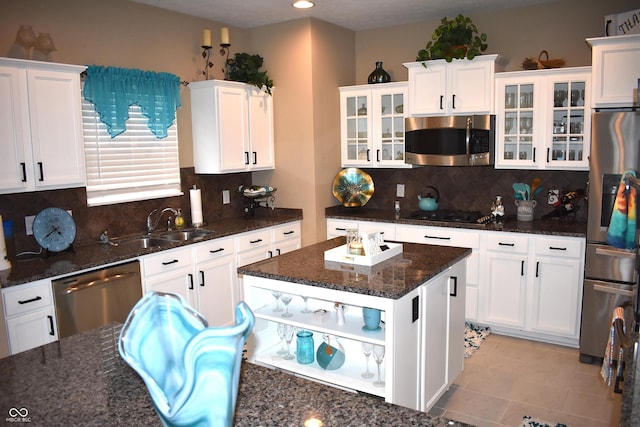 5817 Mustang Ter, Plainfield, IN 46168 - kitchen featuring stainless steel appliances, white cabinets, backsplash, open shelves, and dark stone counters