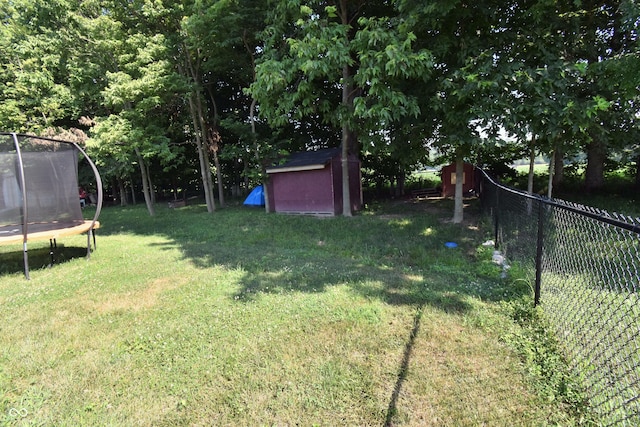 6362 W Friends Way Ct, Paragon, IN 46166 - view of yard featuring a trampoline and a storage shed