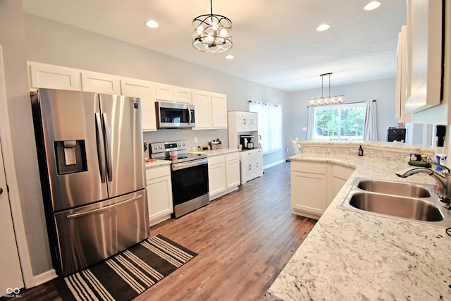 6362 W Friends Way Ct, Paragon, IN 46166 - kitchen featuring stainless steel appliances, a chandelier, recessed lighting, decorative light fixtures, and white cabinetry