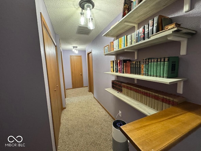 1214 Lindsey Ln, Lebanon, IN 46052 - hallway featuring a textured ceiling and carpet flooring