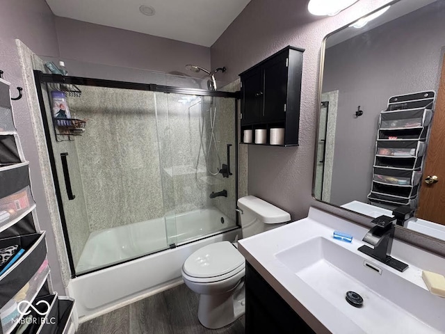 1214 Lindsey Ln, Lebanon, IN 46052 - full bathroom with shower / bath combination with glass door, vanity, wood finished floors, and a textured wall
