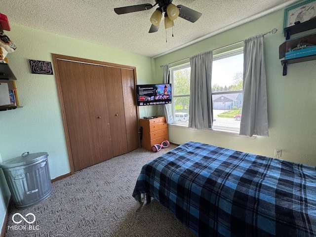 1214 Lindsey Ln, Lebanon, IN 46052 - carpeted bedroom featuring a textured ceiling, a closet, and ceiling fan