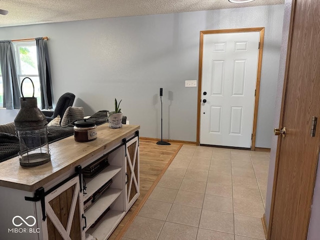 1214 Lindsey Ln, Lebanon, IN 46052 - foyer entrance with a textured ceiling and light tile patterned floors