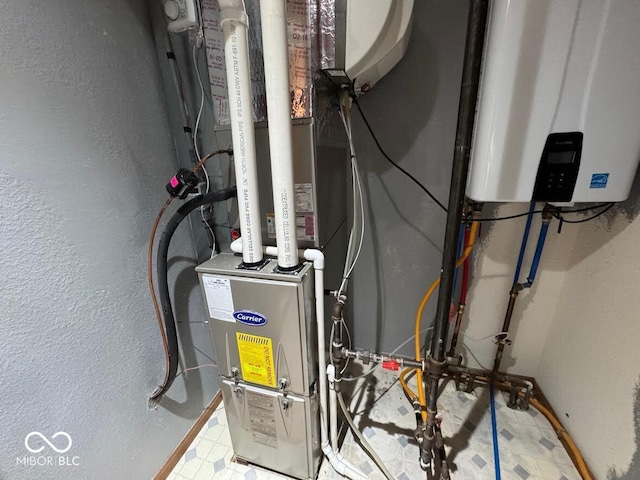 1214 Lindsey Ln, Lebanon, IN 46052 - utility room featuring tankless water heater