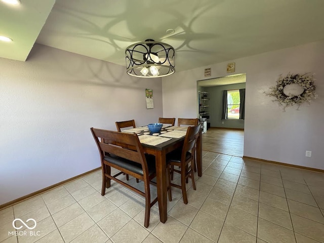 1214 Lindsey Ln, Lebanon, IN 46052 - dining area with light tile patterned floors and a chandelier