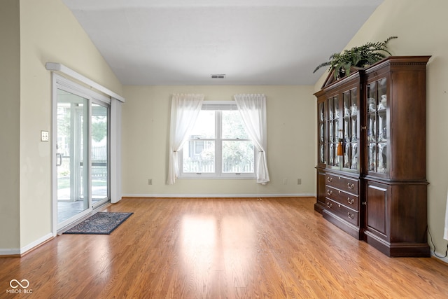 10721 Chesapeake Dr S, Indianapolis, IN 46236 - unfurnished dining area with wood finished floors, healthy amount of natural light, and vaulted ceiling