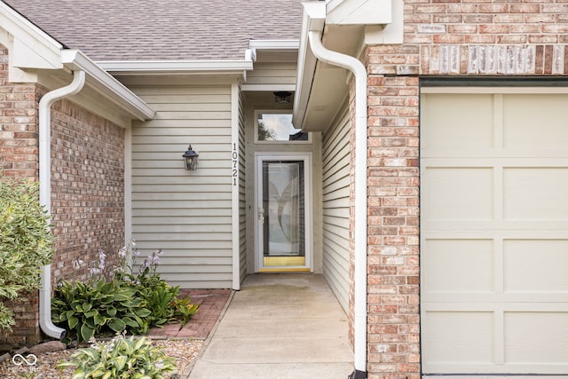 10721 Chesapeake Dr S, Indianapolis, IN 46236 - doorway to property featuring brick siding and roof with shingles
