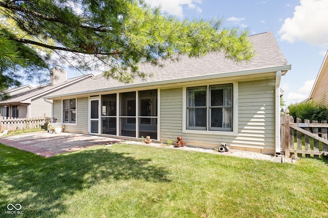 10721 Chesapeake Dr S, Indianapolis, IN 46236 - rear view of property featuring a sunroom, a patio, a shingled roof, and a chimney
