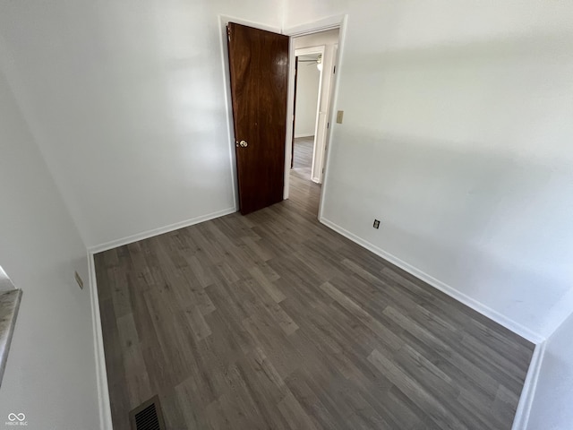 1615 S 9th Ave, Beech Grove, IN 46107 - empty room with dark wood finished floors and baseboards