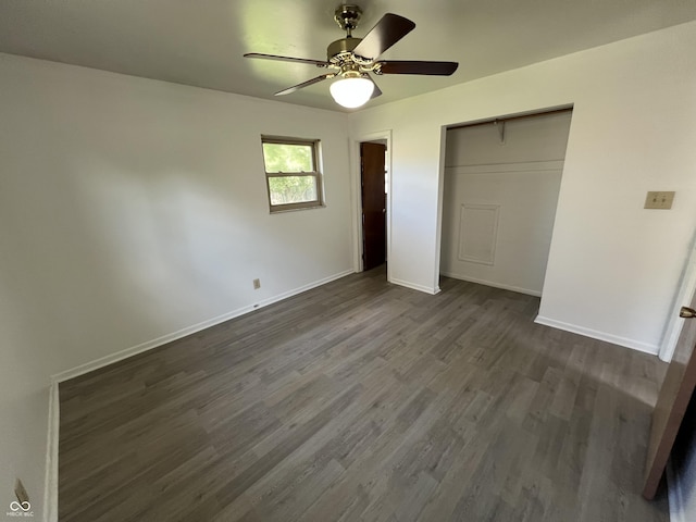 1615 S 9th Ave, Beech Grove, IN 46107 - unfurnished bedroom featuring dark wood finished floors, a closet, and ceiling fan