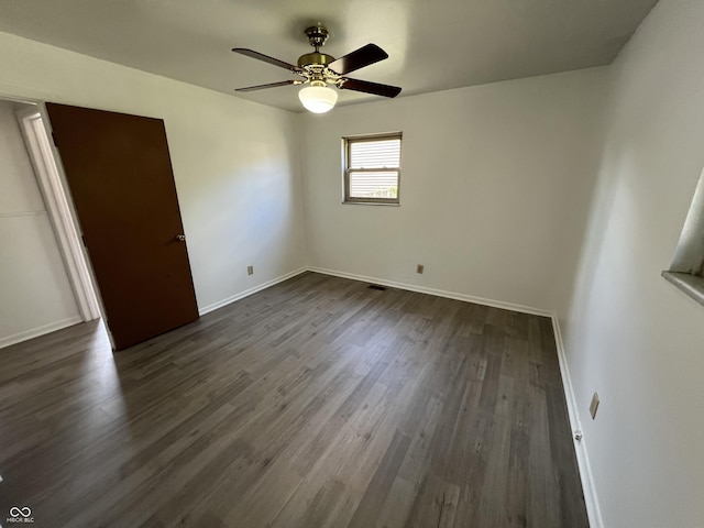 1615 S 9th Ave, Beech Grove, IN 46107 - unfurnished bedroom featuring dark wood-style floors and a ceiling fan