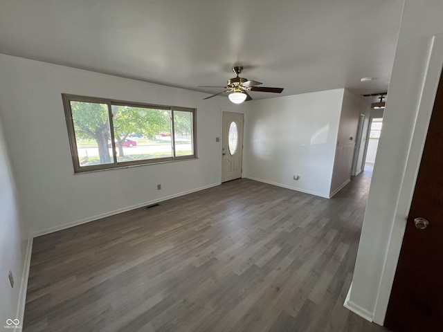 1615 S 9th Ave, Beech Grove, IN 46107 - unfurnished living room with ceiling fan, plenty of natural light, and dark wood-style floors