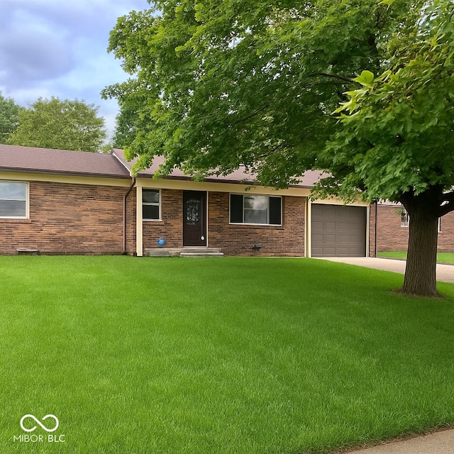 1615 S 9th Ave, Beech Grove, IN 46107 - ranch-style home with a front yard, an attached garage, concrete driveway, and brick siding