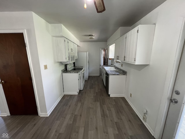 1615 S 9th Ave, Beech Grove, IN 46107 - kitchen with white appliances, dark wood finished floors, white cabinetry, and dark countertops