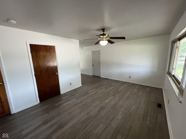 1615 S 9th Ave, Beech Grove, IN 46107 - unfurnished bedroom with dark wood finished floors and ceiling fan