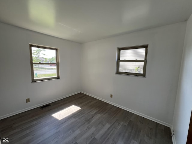 1615 S 9th Ave, Beech Grove, IN 46107 - unfurnished room with dark wood-style floors and baseboards