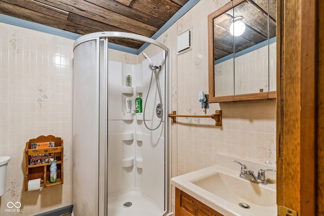 8701 E Splinter Ridge Rd, Madison, IN 47250 - bathroom with tile walls, a stall shower, and vanity