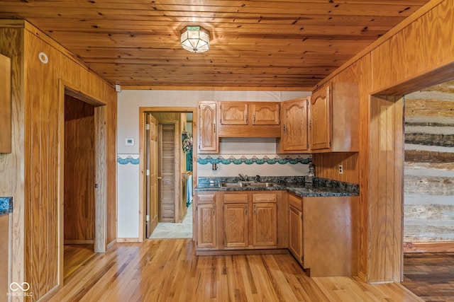 8701 E Splinter Ridge Rd, Madison, IN 47250 - kitchen featuring wood ceiling, light wood-type flooring, brown cabinets, wooden walls, and tasteful backsplash