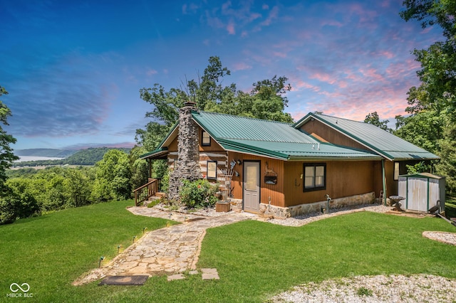 8701 E Splinter Ridge Rd, Madison, IN 47250 - chalet / cabin featuring a shed, a chimney, a yard, and a metal roof