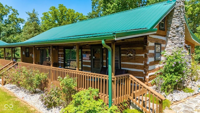 8701 E Splinter Ridge Rd, Madison, IN 47250 - view of front of property with a metal roof, log exterior, and a chimney