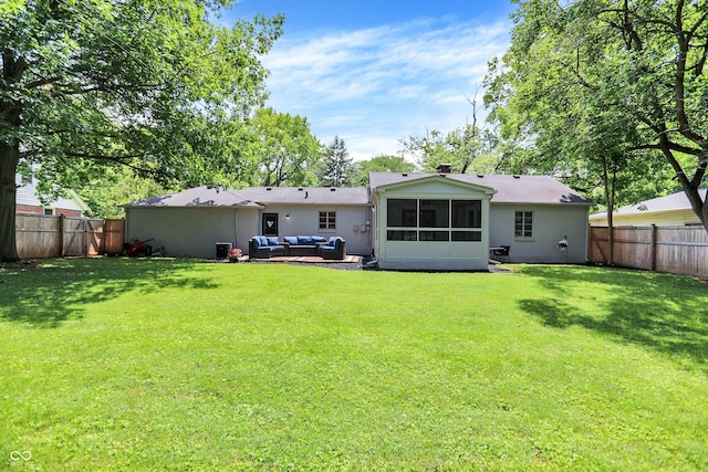 5456 N Park Dr, Indianapolis, IN 46220 - rear view of house featuring an outdoor hangout area, a fenced backyard, and a sunroom