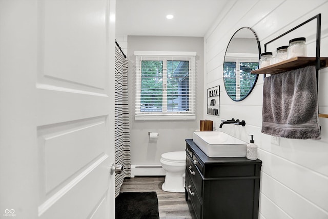5456 N Park Dr, Indianapolis, IN 46220 - bathroom featuring a baseboard radiator, vanity, wood finished floors, recessed lighting, and curtained shower