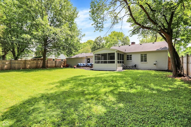 5456 N Park Dr, Indianapolis, IN 46220 - rear view of house featuring a sunroom and a fenced backyard