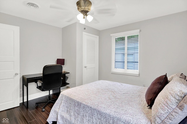 5456 N Park Dr, Indianapolis, IN 46220 - bedroom with dark wood-style flooring, an office area, and a ceiling fan