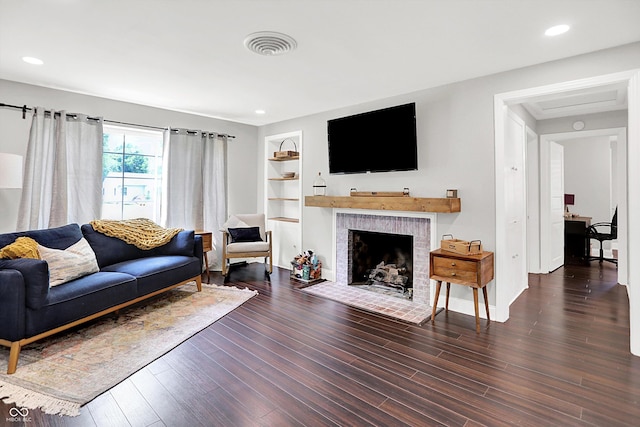 5456 N Park Dr, Indianapolis, IN 46220 - living area with wood finished floors, a fireplace, built in features, and recessed lighting