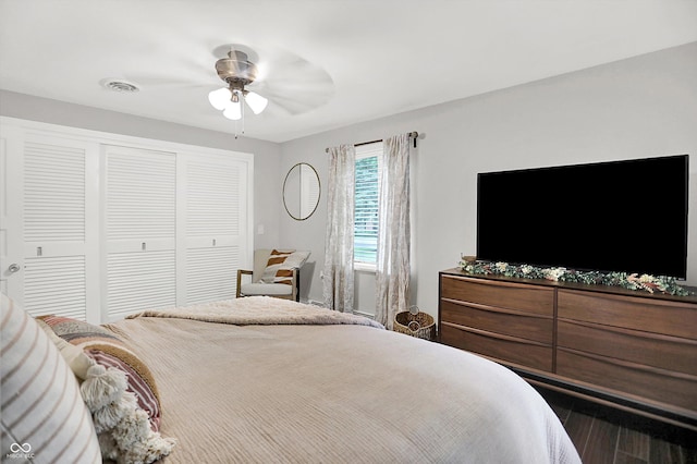 5456 N Park Dr, Indianapolis, IN 46220 - bedroom with a closet, a ceiling fan, and wood finished floors