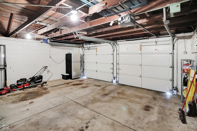 5456 N Park Dr, Indianapolis, IN 46220 - garage with freestanding refrigerator and a garage door opener