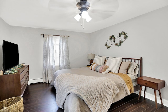 5456 N Park Dr, Indianapolis, IN 46220 - bedroom with a baseboard radiator, dark wood-style flooring, and a ceiling fan