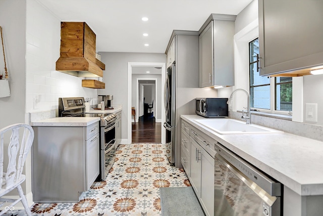 5456 N Park Dr, Indianapolis, IN 46220 - kitchen featuring appliances with stainless steel finishes, gray cabinetry, recessed lighting, light countertops, and premium range hood