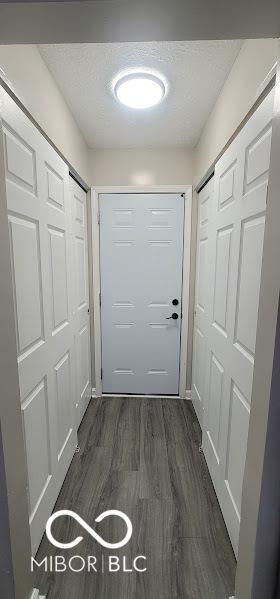 5648 Hyacinth Way, Indianapolis, IN 46254 - doorway with dark wood-type flooring