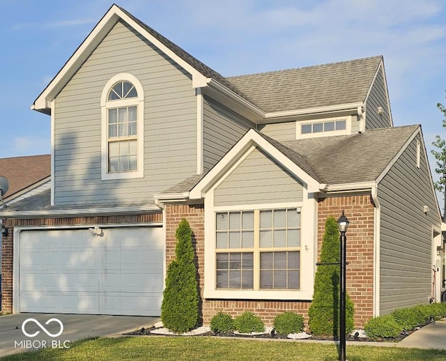 5648 Hyacinth Way, Indianapolis, IN 46254 - traditional home featuring brick siding, roof with shingles, driveway, and an attached garage