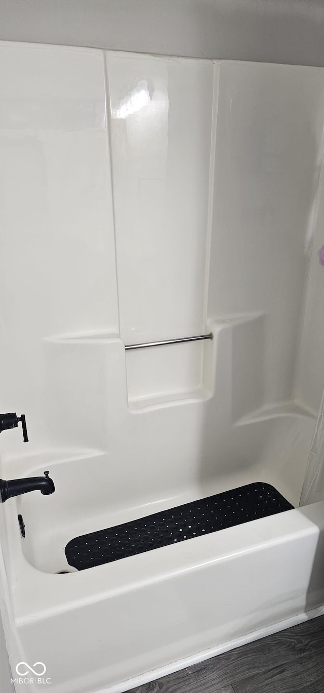 5648 Hyacinth Way, Indianapolis, IN 46254 - bathroom featuring wood finished floors and bathing tub / shower combination