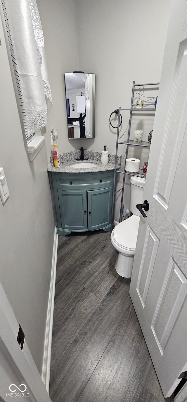 5648 Hyacinth Way, Indianapolis, IN 46254 - bathroom featuring vanity and wood finished floors