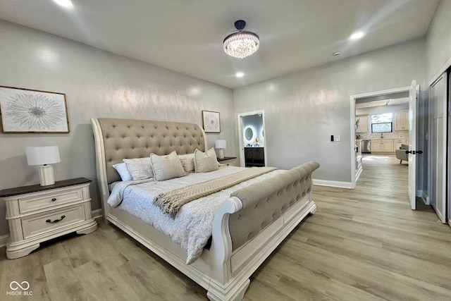1440 S New Jersey St, Indianapolis, IN 46225 - bedroom with light wood-type flooring, recessed lighting, and connected bathroom